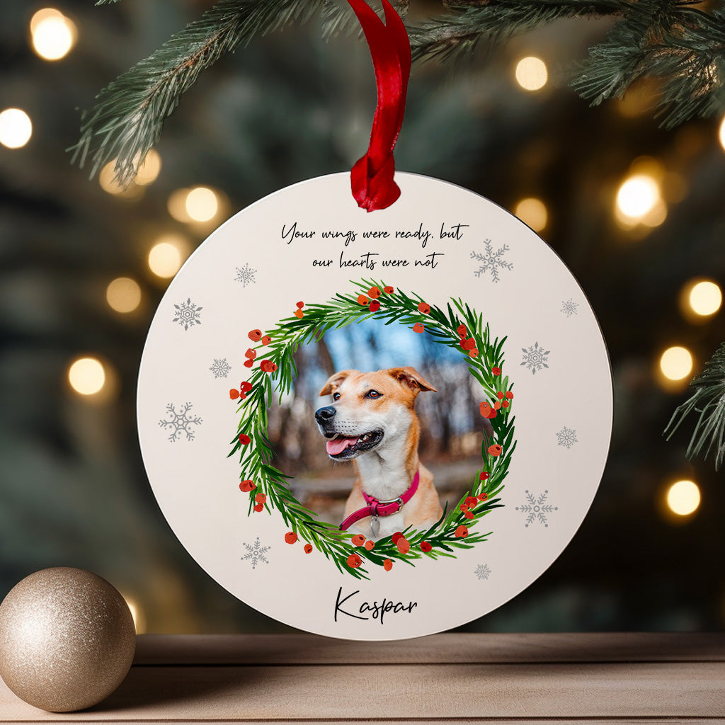 White acrylic pet memorial Christmas ornament with red ribbon and wreath design, personalised with dog photo and name – remembrance bauble gift for pet loss