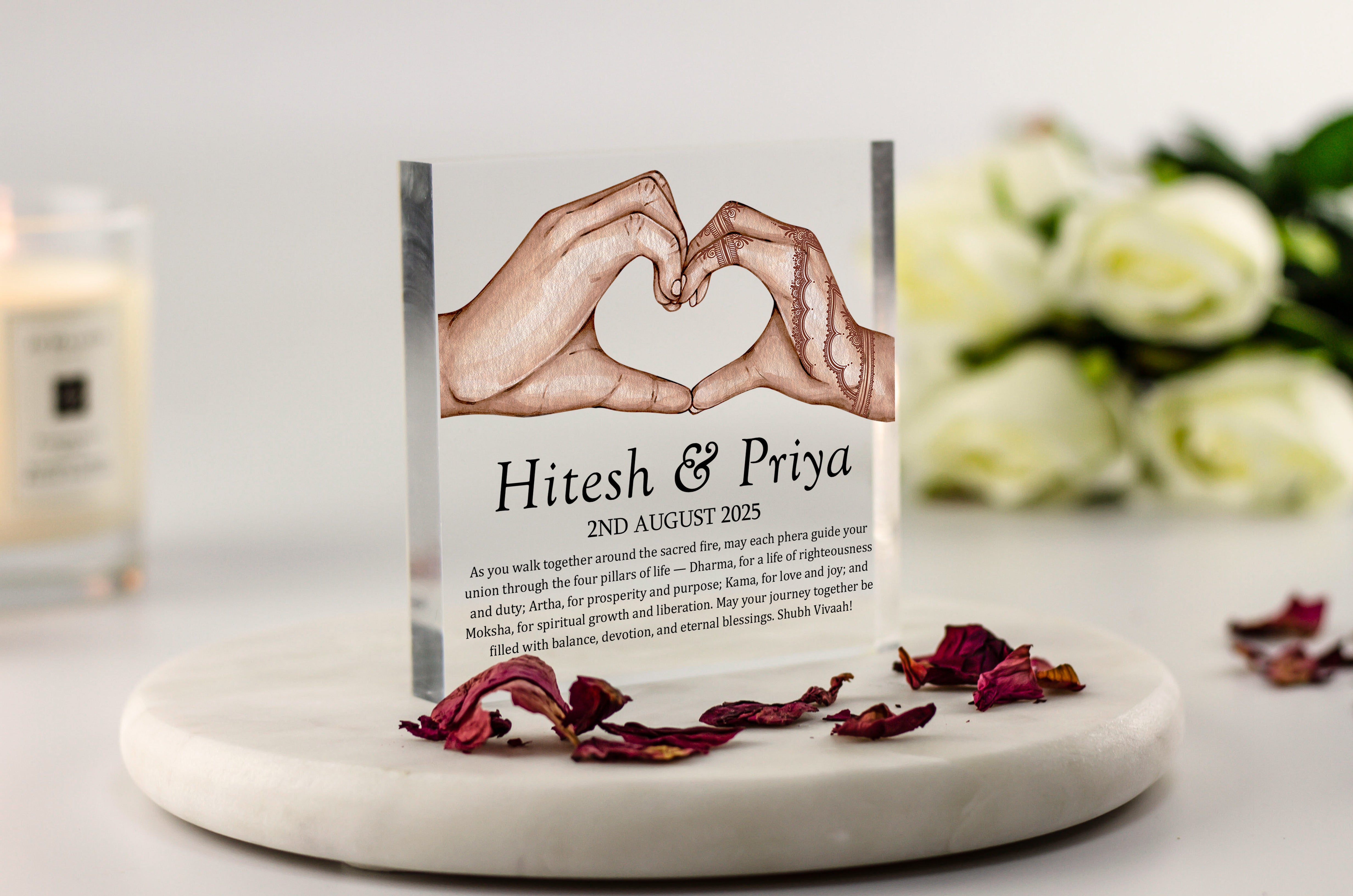 Indian wedding acrylic block with henna hands forming heart, couple’s names and date, featuring Hindu phera blessing and four pillars of life quote.