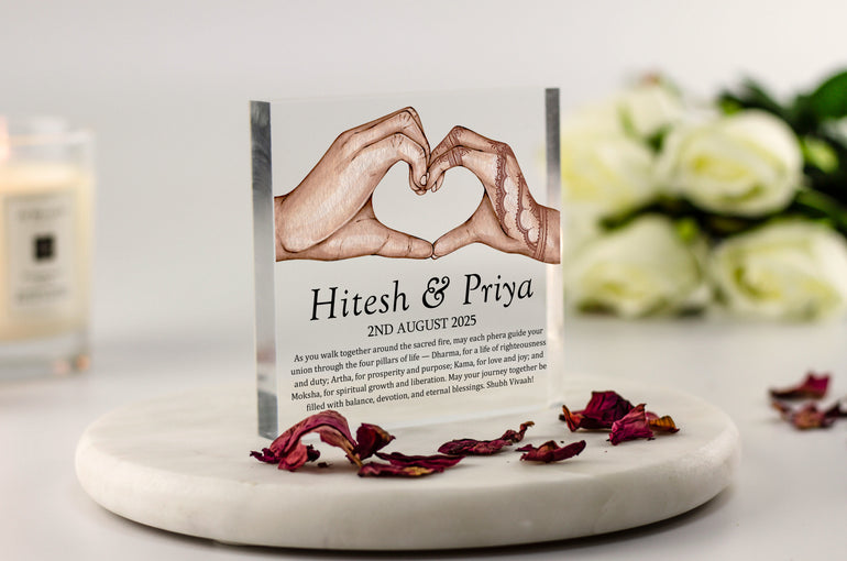 Indian wedding acrylic block with henna hands forming heart, couple’s names and date, featuring Hindu phera blessing and four pillars of life quote.