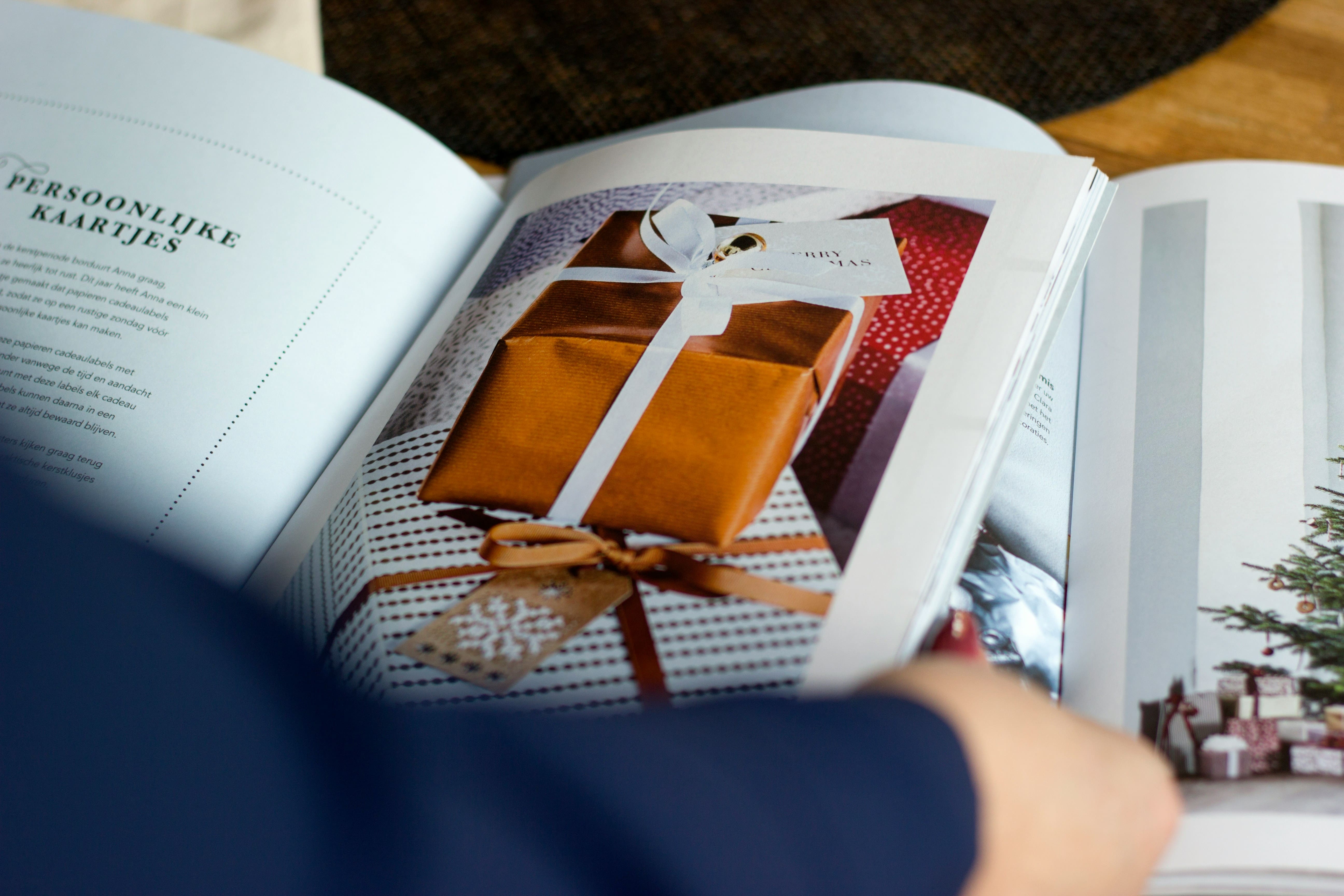 Wrapped present image in a magazine that is being read