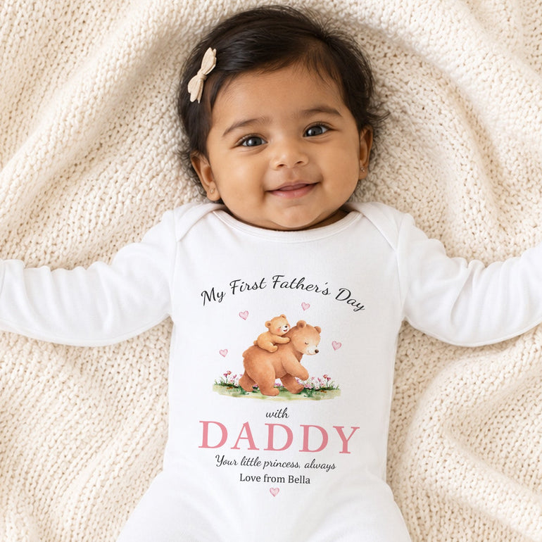 Baby girl wearing a personalised First Father’s Day princess bear baby grow for Daddy.