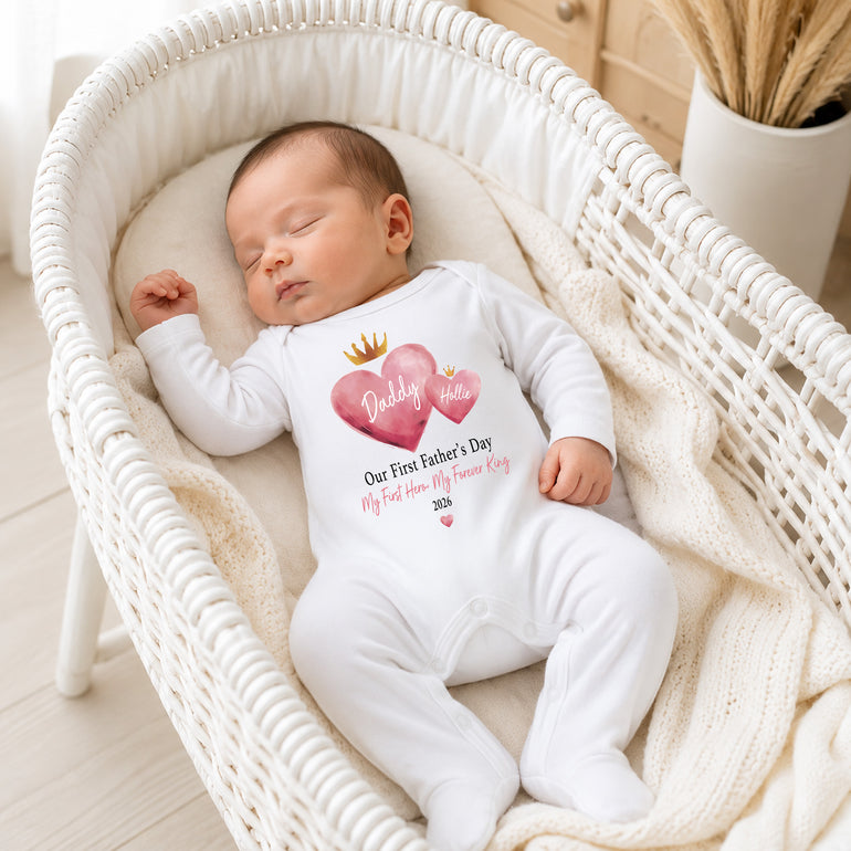 Personalised pink king heart First Father’s Day baby grow with custom Daddy wording.