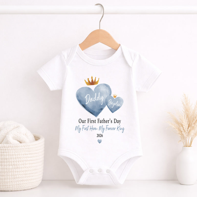 Personalised blue king heart First Father’s Day baby vest with Daddy and child names.