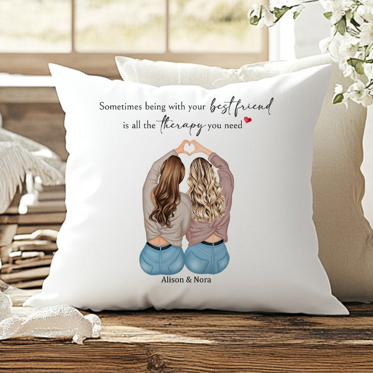 Personalised best friend cushion with two female characters making a heart with their hands and custom names