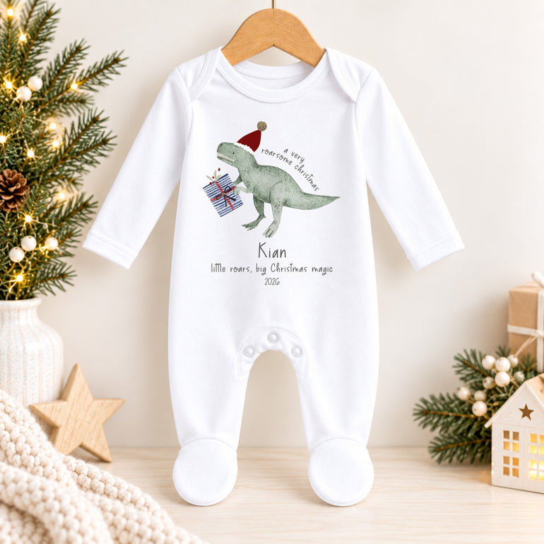 Personalised dinosaur Christmas baby grow with festive dinosaur design, child’s name and chosen year