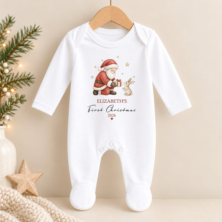 Personalised First Christmas baby grow with Santa giving a bunny a present, child’s name and chosen year
