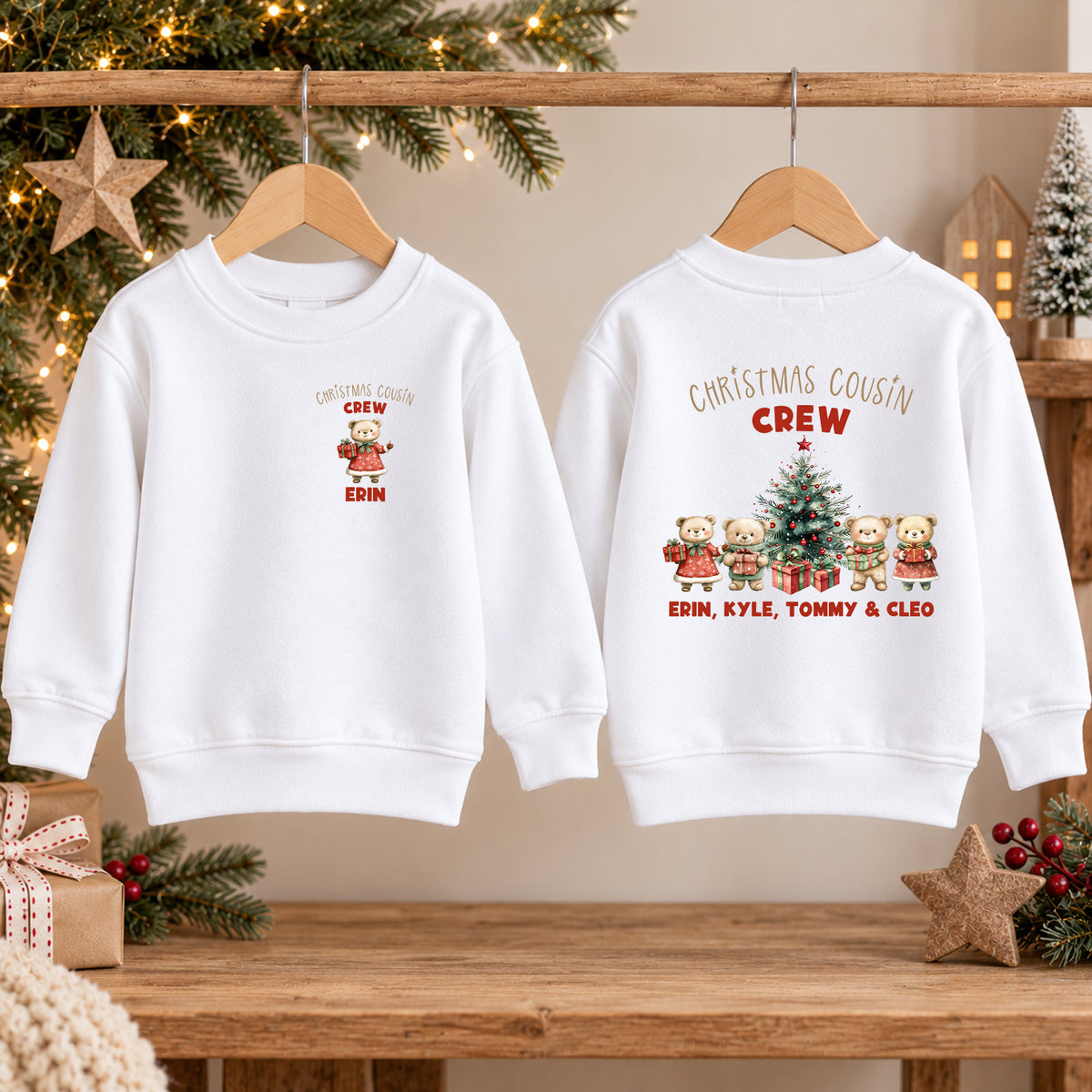Boy in a navy teddy bear Christmas jumper, front with a small Christmas Cousin Crew bear and the name Kyle, back with four bears round a tree and the names Erin, Kyle, Tommy and Cleo