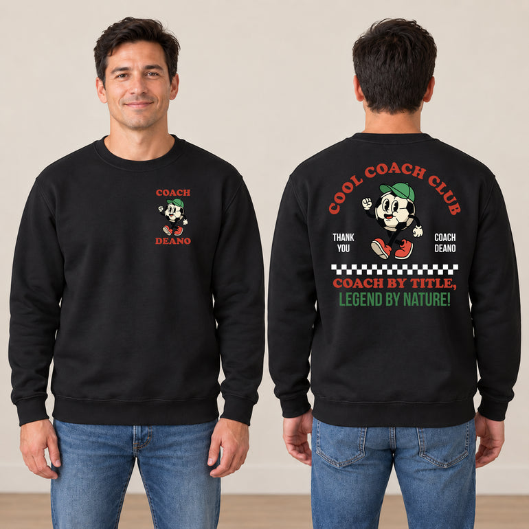 Man in a black Cool Coach Club football coach gift sweatshirt, the back printed with Cool Coach Club, a retro cartoon football character in a green cap, Thank You, Coach Deano and Coach by Title, Legend by Nature, the front with a small Coach Deano badge