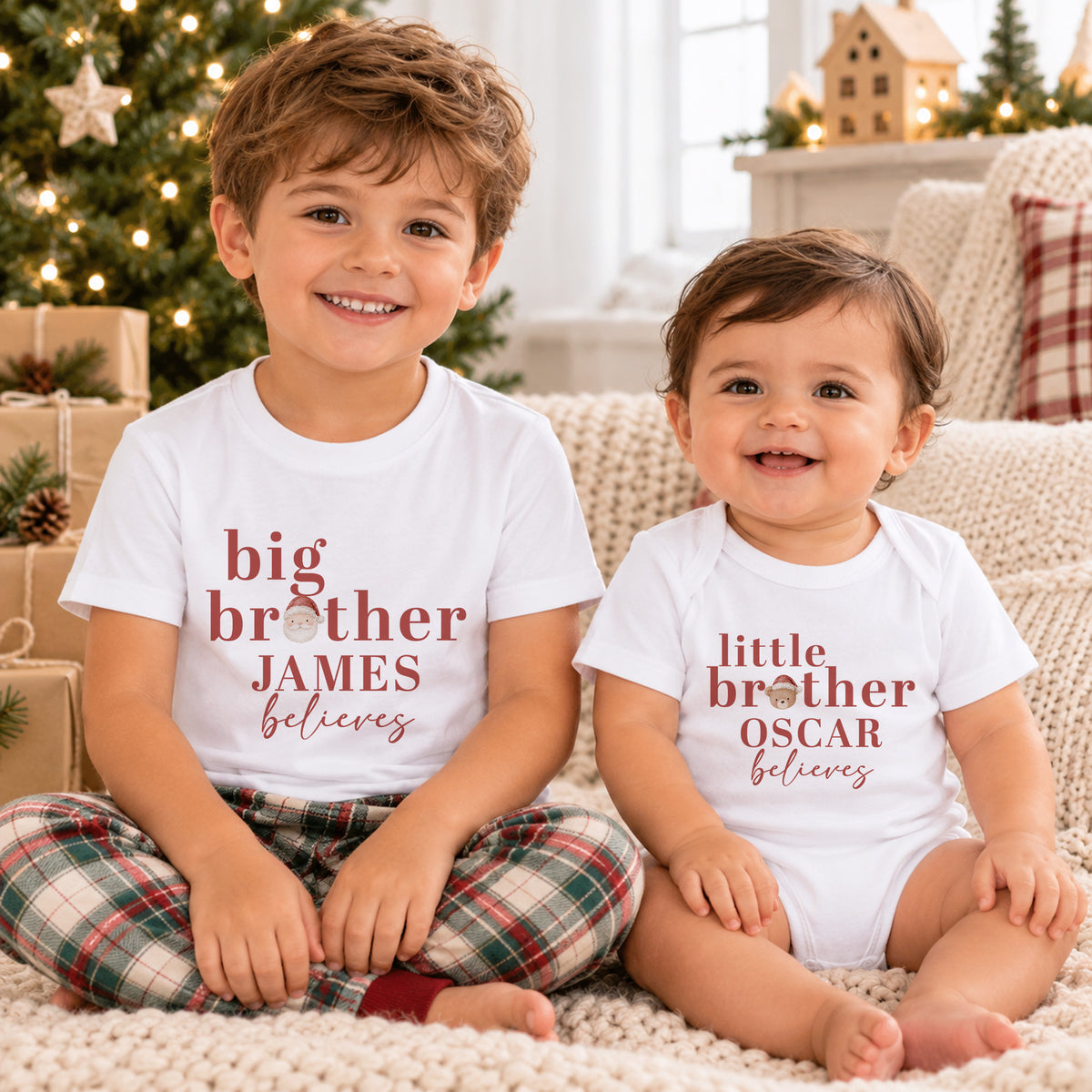 Big Brother and Little Brother wearing personalised matching Christmas clothing with names, Believes wording and Santa and teddy head designs