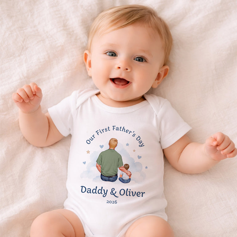 Personalised First Father’s Day baby vest with Daddy and child cloud scene illustration, custom name and year.