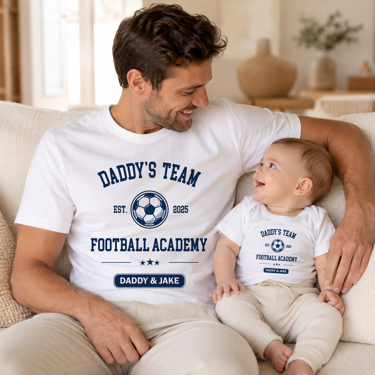 Dad and child wearing matching white football academy T-shirts with personalised Daddy and child names.
