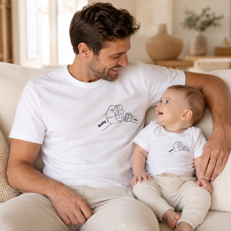 Personalised Daddy and kids matching T-shirts with printed fist bump line art and child names.