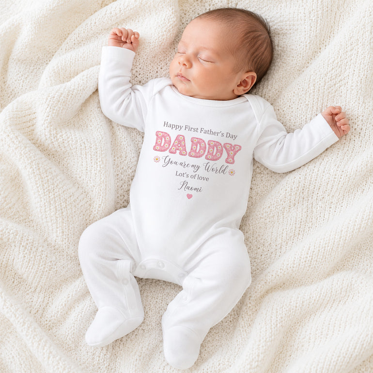 White baby grow with Happy First Father’s Day Daisy Daddy design and personalised name Naomi.
