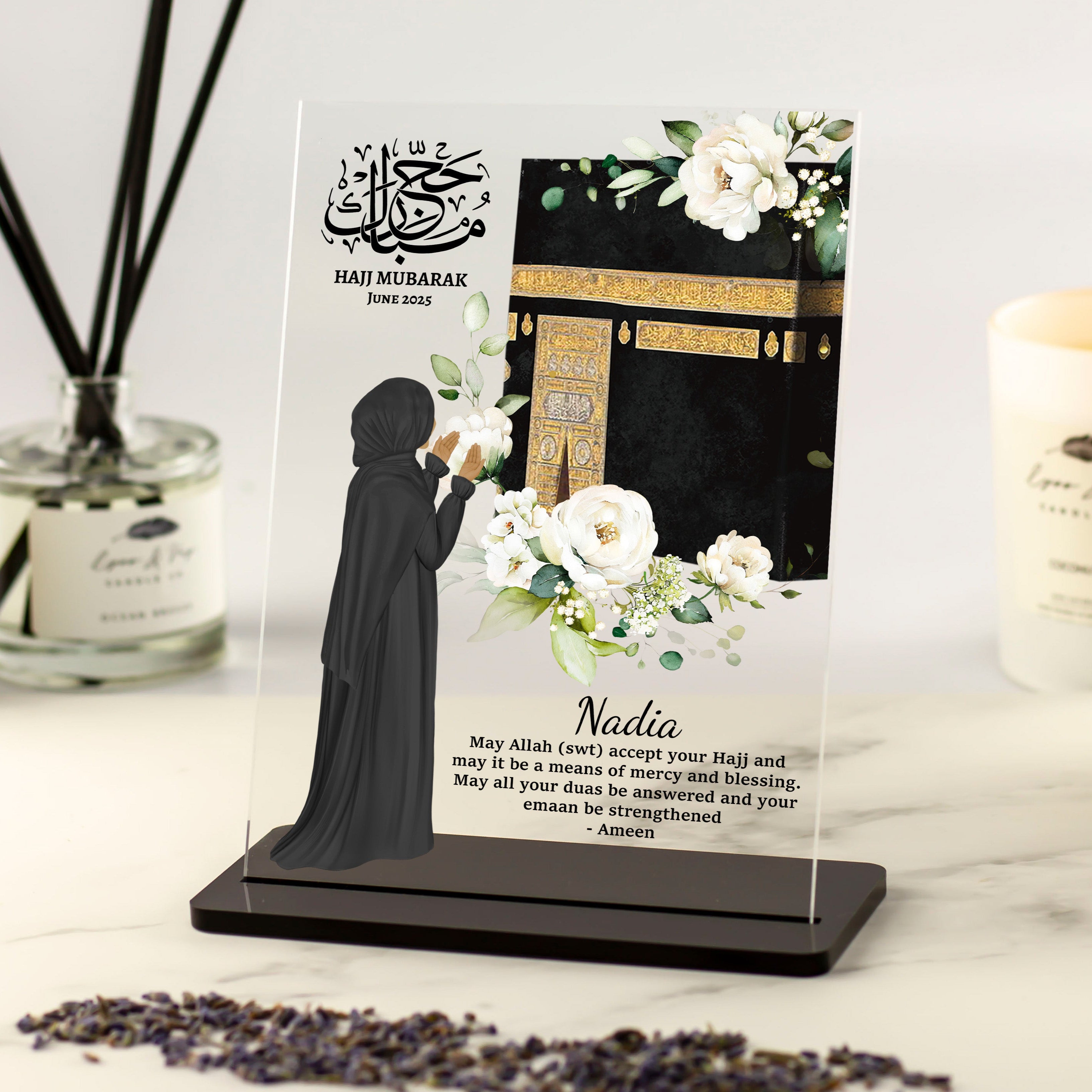 Personalised Muslim woman Hajj or Umrah acrylic plaque with floral Kaaba design and hijabi figure praying, reading or holding Quran.
