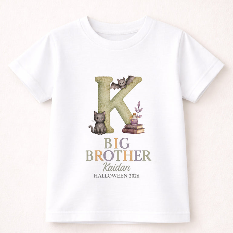 Personalised Big Brother Halloween T-shirt with an illustrated letter K, black cat, bat, the name Kaidan and Halloween 2026.