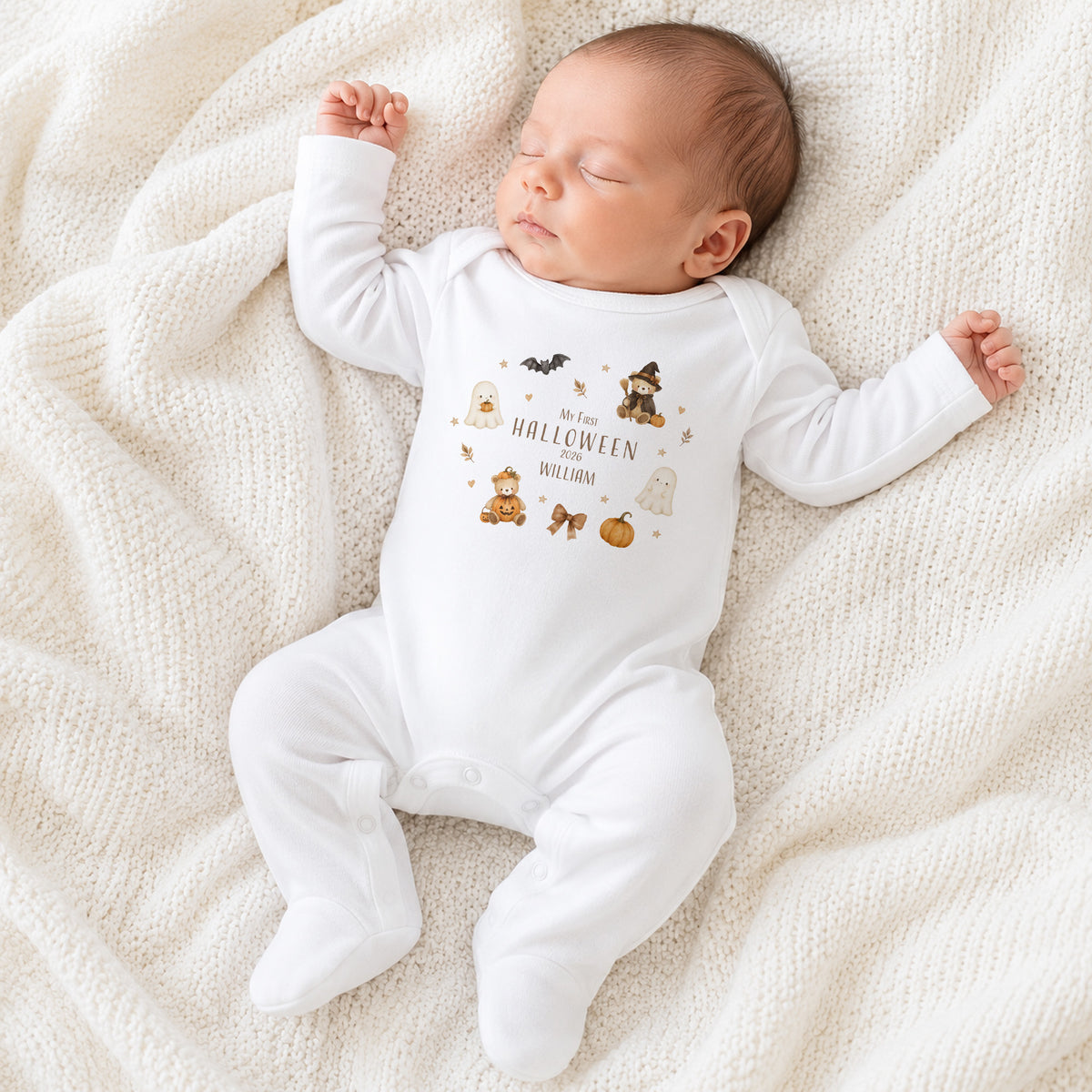 Baby wearing personalised My First Halloween baby grow with teddy ghost pumpkin design