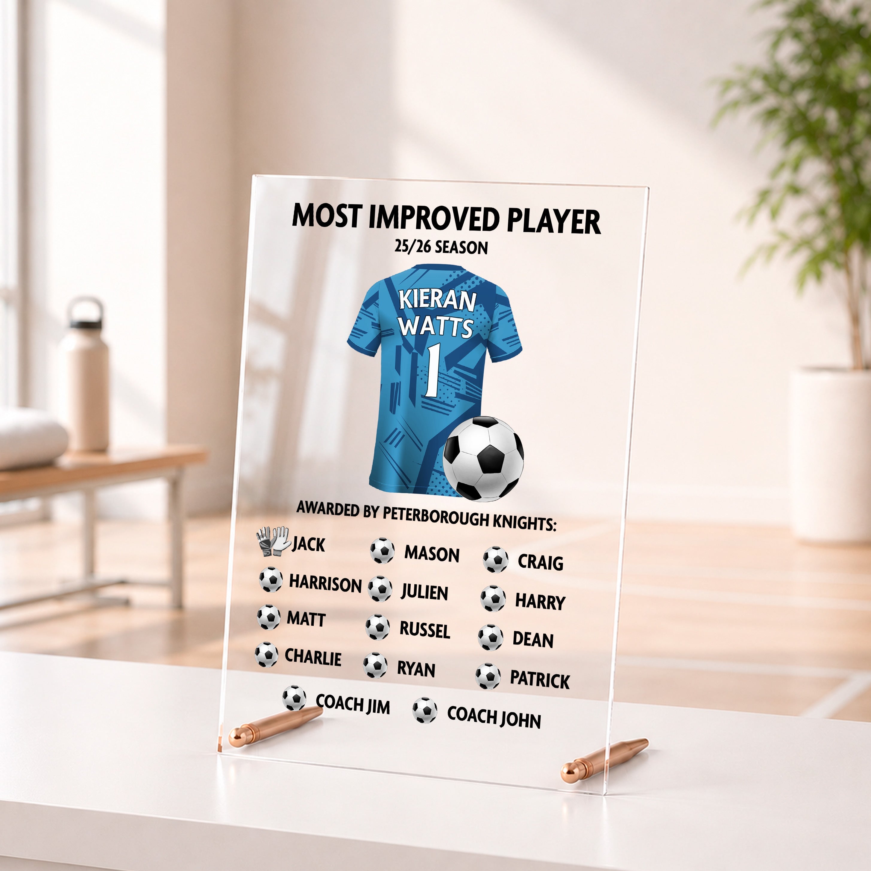 Personalised Most Improved Player acrylic football award with player name, shirt design and team names.