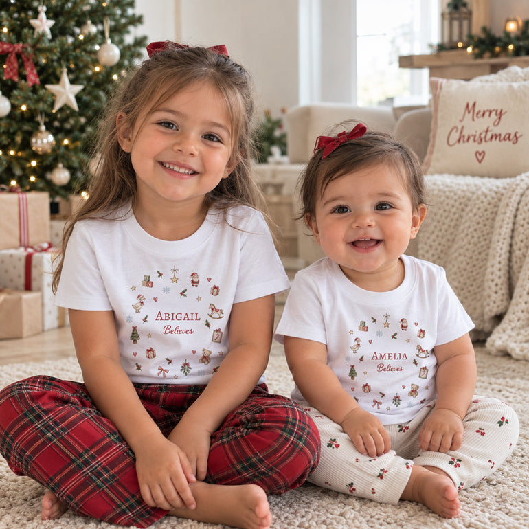 Children wearing personalised Christmas T-shirts with individual names and matching Believes festive designs