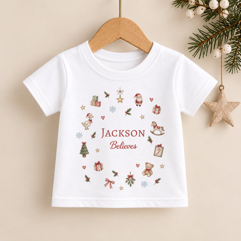 Personalised kids Christmas T-shirt with child’s name, Believes wording and miniature festive Christmas illustrations