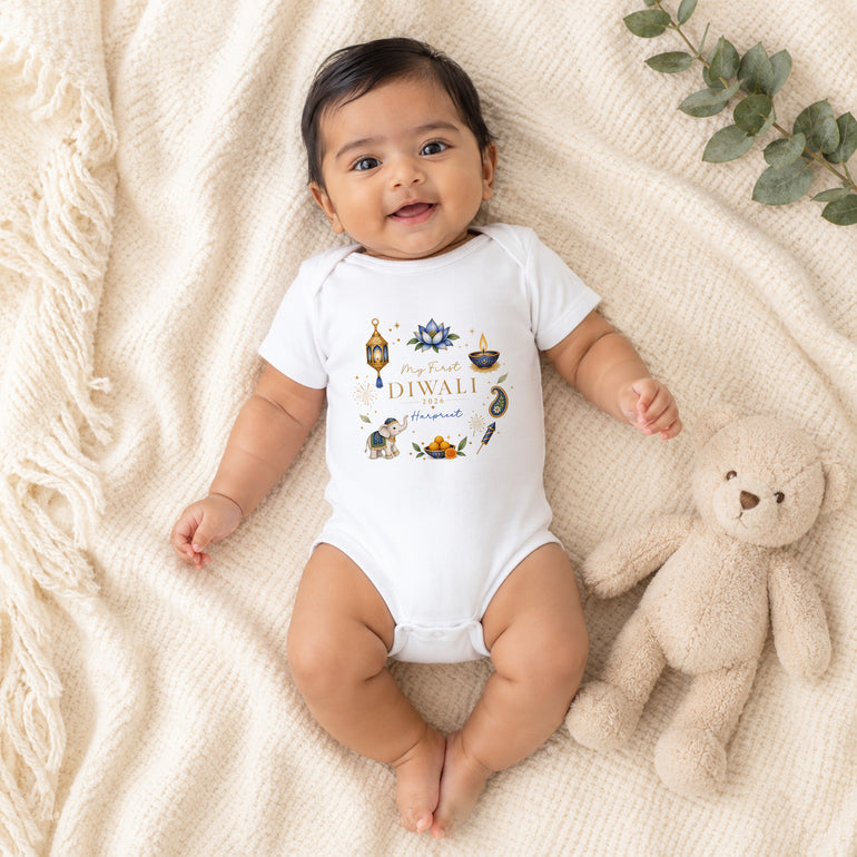 Baby boy wearing personalised My First Diwali vest with blue Diwali wreath