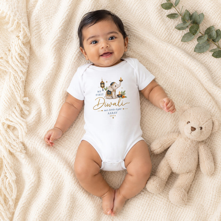 Baby wearing personalised My First Diwali vest with blue elephant design