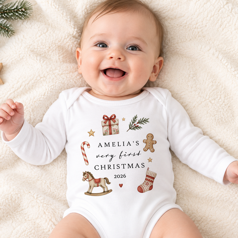 Baby wearing personalised My First Christmas outfit with name and year in festive illustrated design