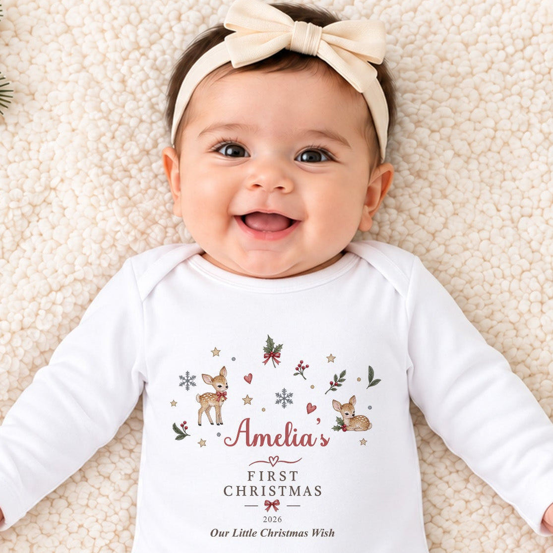 Baby wearing personalised Reindeer First Christmas baby grow with festive deer, holly and snowflakes, child’s name and custom Christmas year