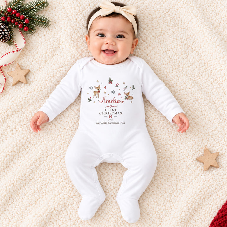 Baby wearing personalised Reindeer First Christmas baby grow with festive deer, holly and snowflakes, child’s name and custom Christmas year