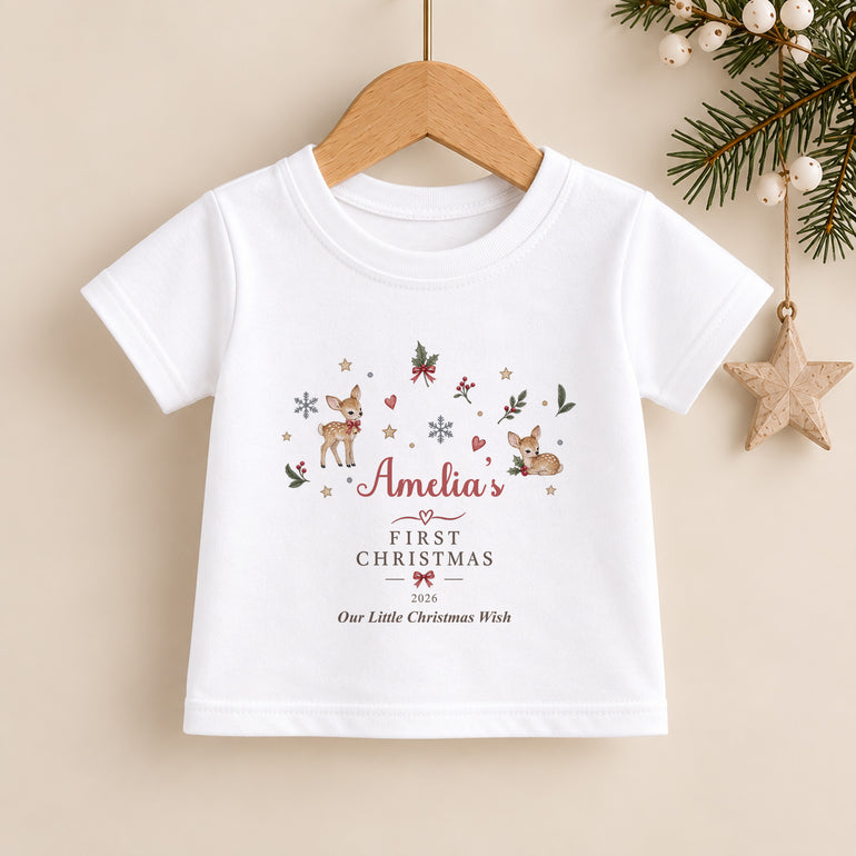 Personalised kids First Christmas T-shirt with festive reindeer and holly design, child’s name, chosen year and Little Christmas Wish wording