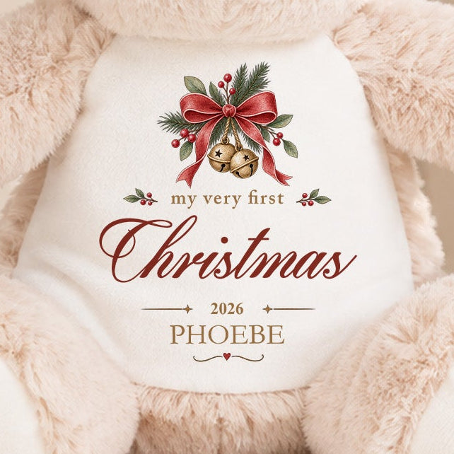 Close-up of personalised My Very First Christmas reindeer design with gold bells, red bow, name Phoebe and year