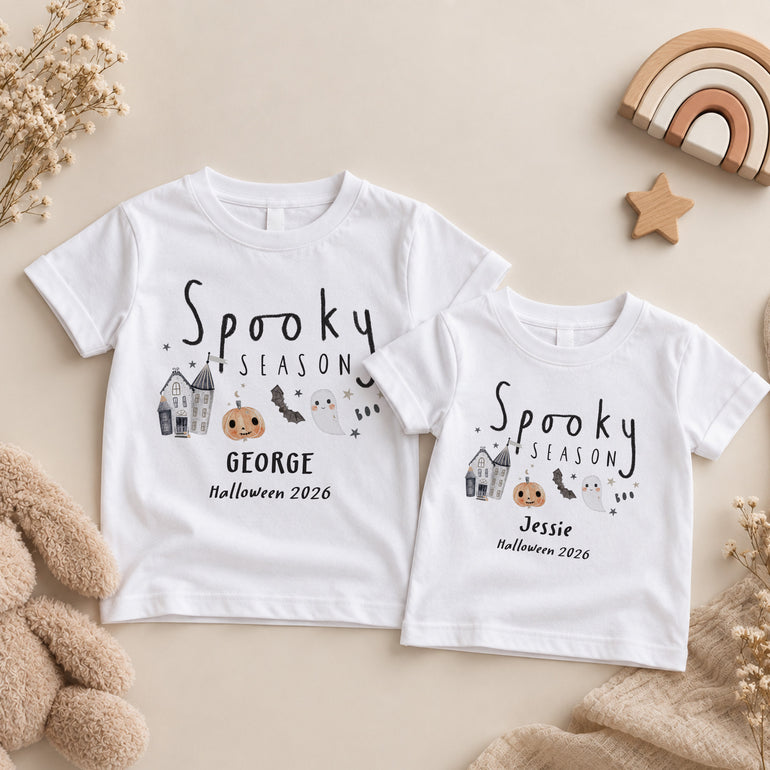 Two personalised kids matching Halloween T-shirts with Spooky Season design, individual names and custom Halloween year