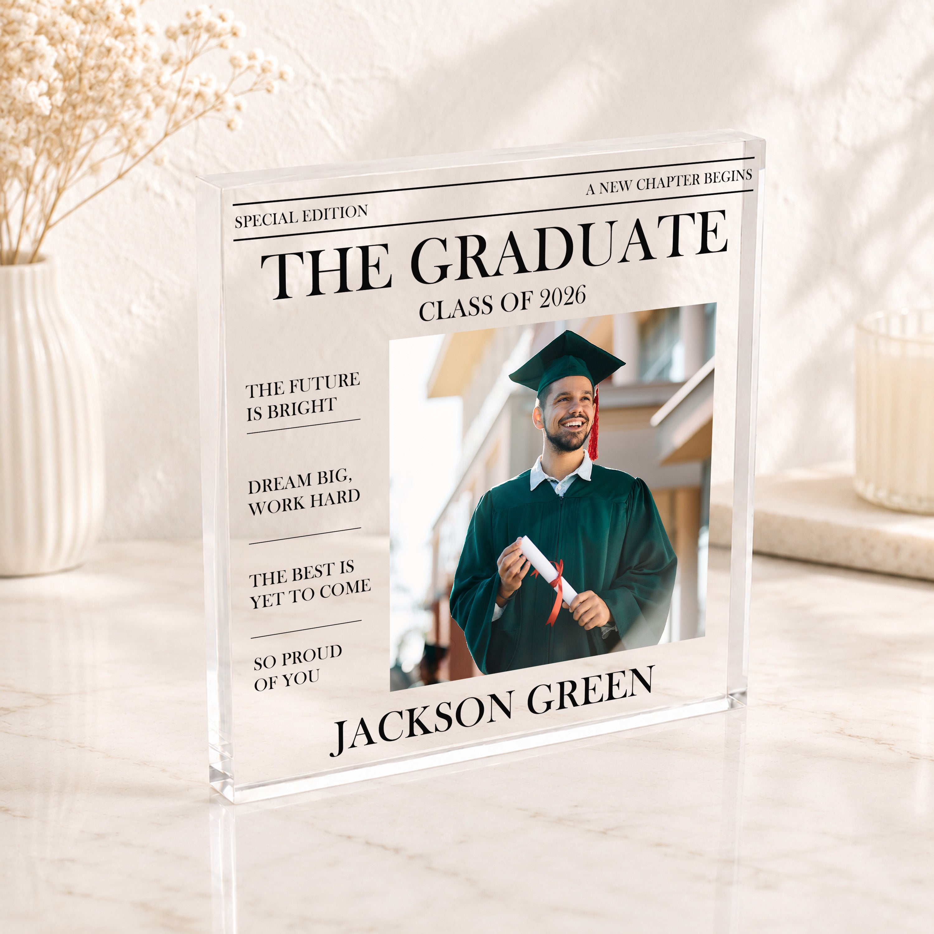 The Graduate newspaper style graduation photo block with name, photo and Class of 2026 wording