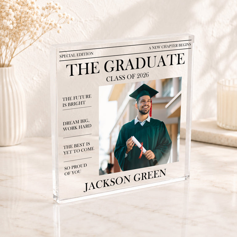 The Graduate newspaper style graduation photo block with name, photo and Class of 2026 wording