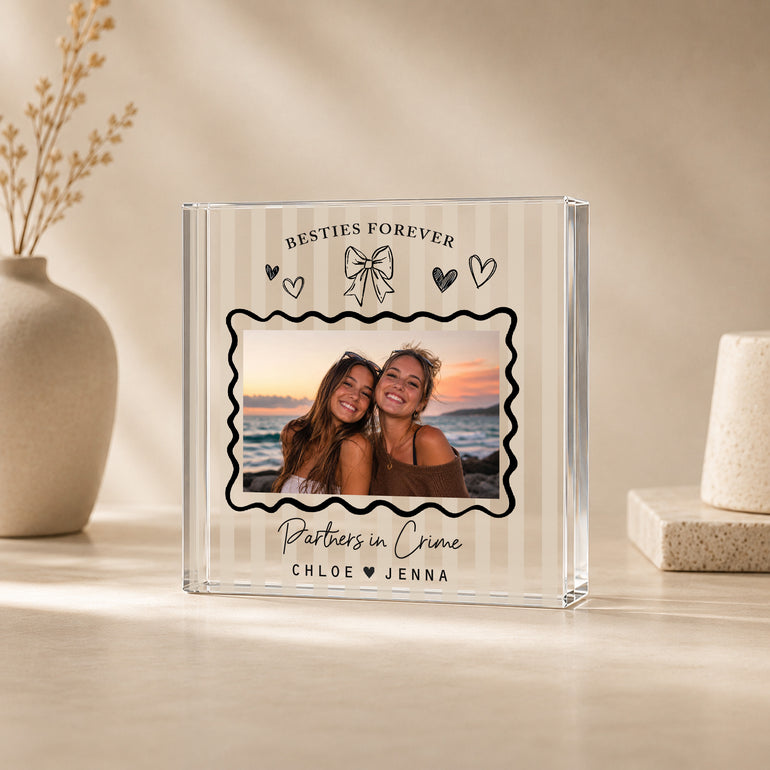 Celebrate a friendship that means everything with this personalised best friend photo block, featuring your chosen photo, names and playful custom wording. Styled with a doodle-inspired bow, hearts and wavy photo frame, this square freestanding acrylic block is perfect for besties, and can also be personalised for sisters, cousins or other close relationships.

Personalisation

You can personalise this design with:

One chosen photo
Top curved wording above the photo
Examples: Besties Forever, Sisters Forev