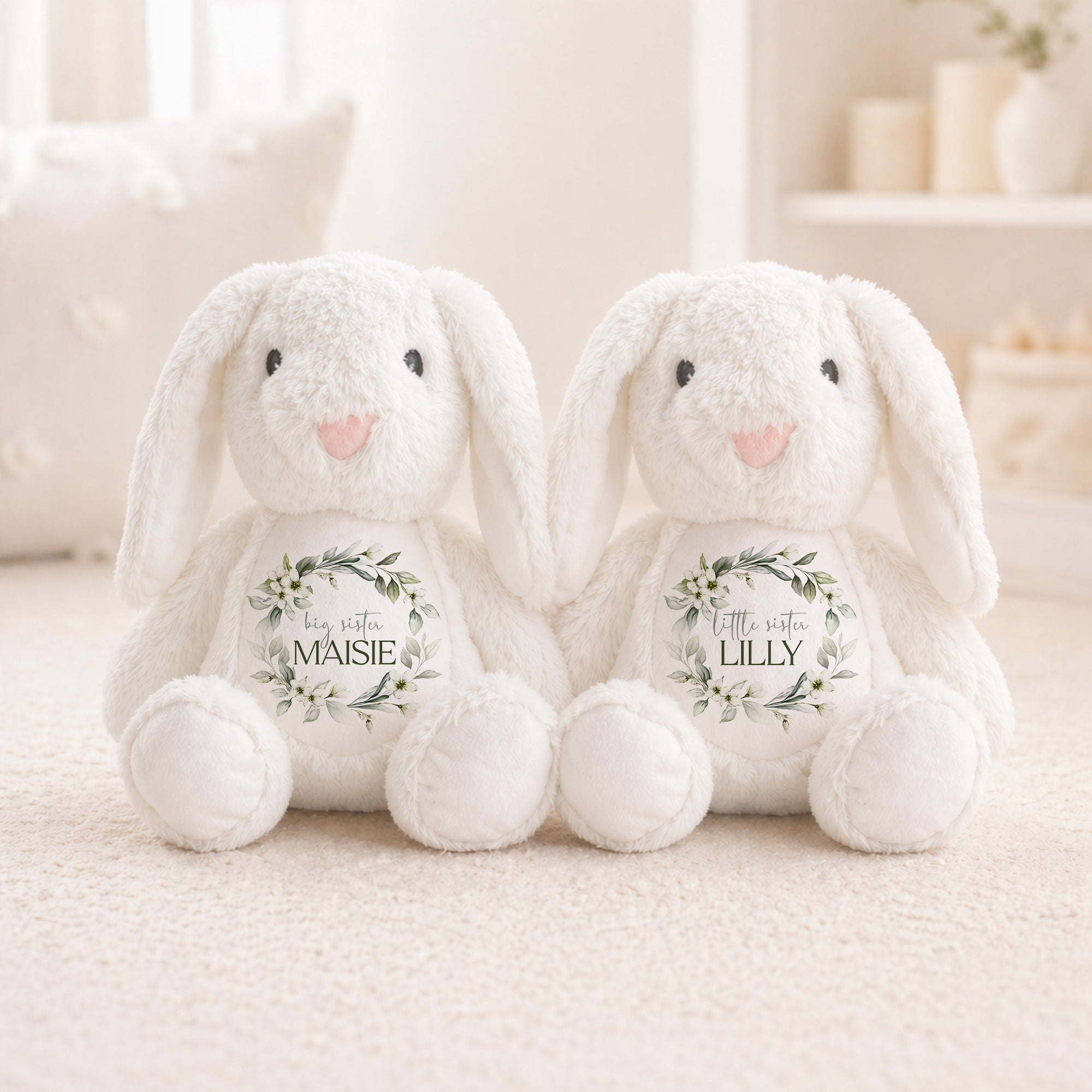 Two white plush bunnies with personalized names on a light background