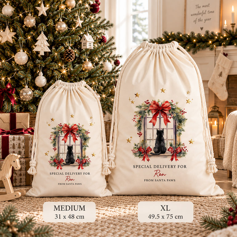 Medium and XL cat Christmas sacks displayed side by side, showing the festive window design and measurements beneath each size.