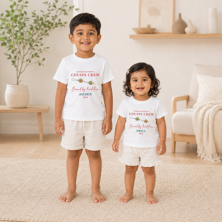 Two children wearing personalised white Raksha Bandhan Cousin Crew T-shirts with the names Jayden and Priya.
