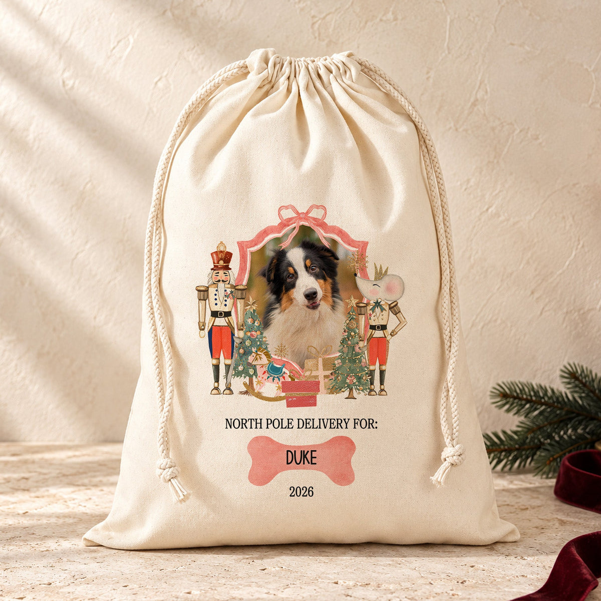 Personalised dog photo Christmas sack with North Pole Delivery wording, pet name, year, nutcrackers and festive Christmas design.