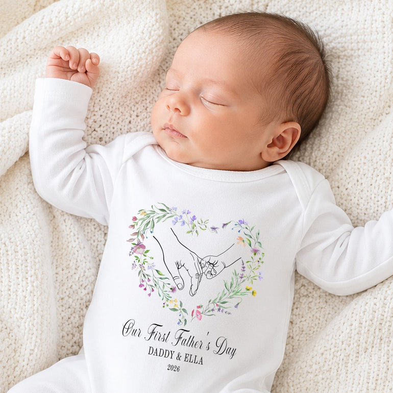 Personalised First Father’s Day floral hand baby grow with custom Daddy and child names.
