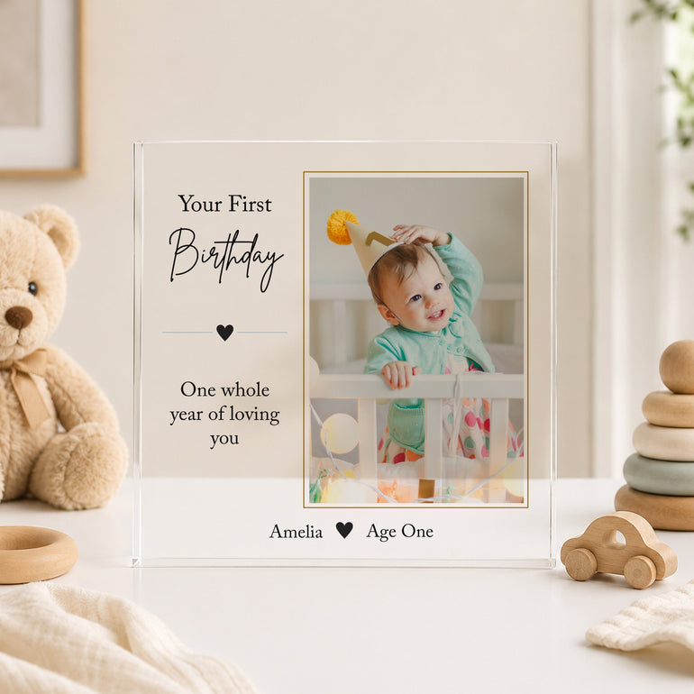 Personalised first birthday acrylic photo block featuring child's photograph and name with Your First Birthday design