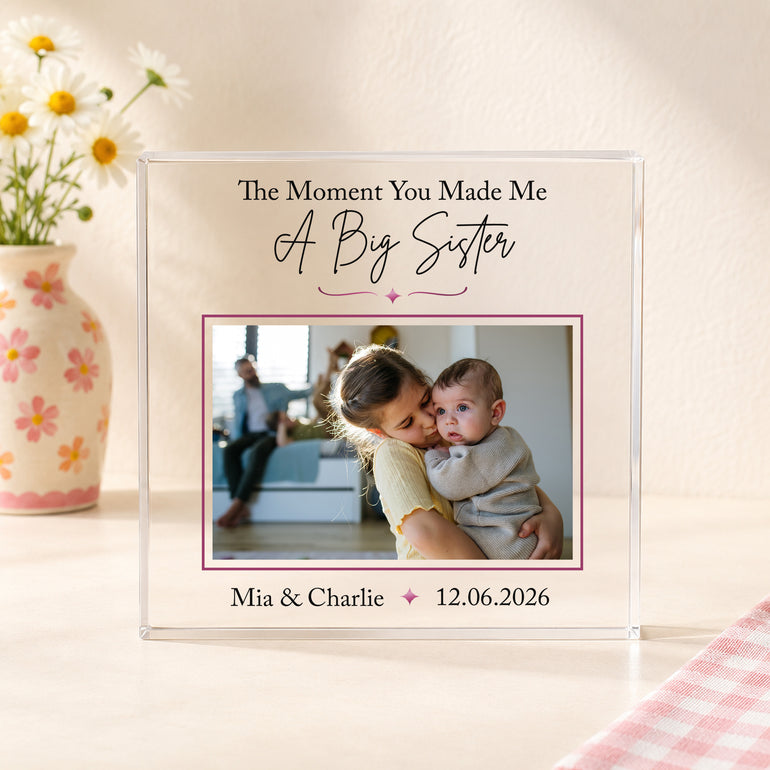 Personalised big sister acrylic photo block with photograph of older sister holding new baby, children's names and special date.