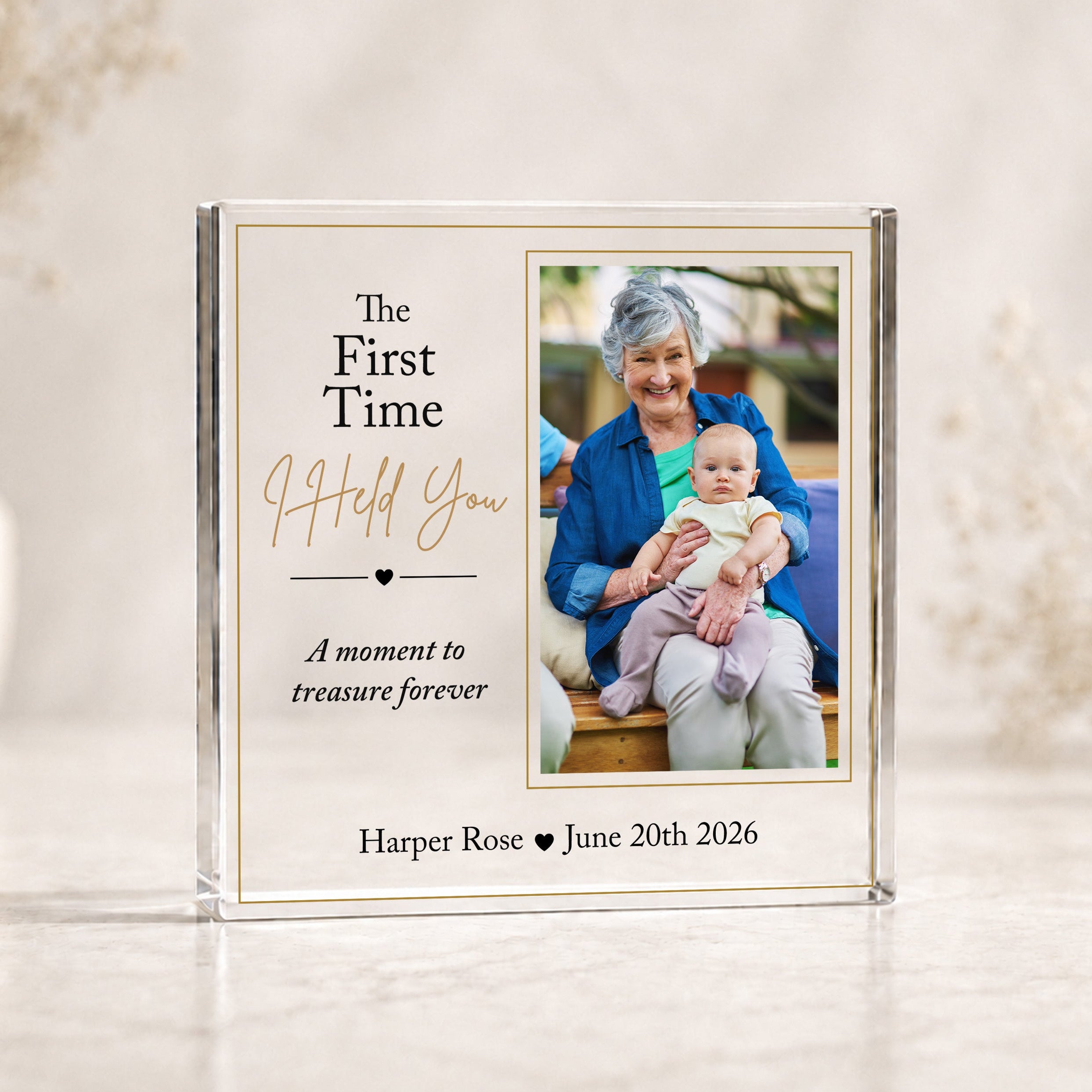 Personalised new Grandma first cuddle acrylic photo block featuring grandmother holding her new grandchild with baby's name and date.