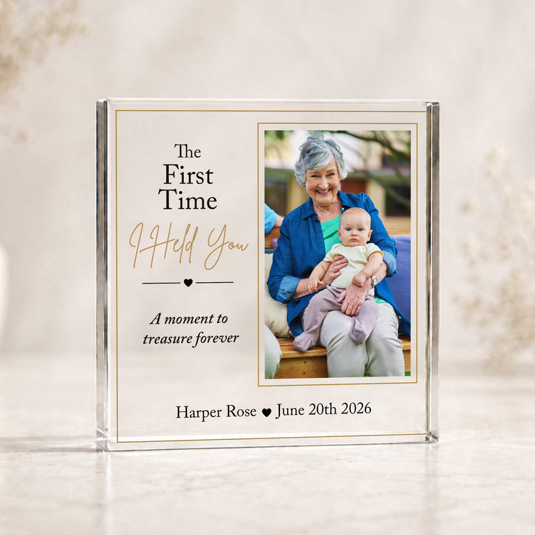 Personalised new Grandma first cuddle acrylic photo block featuring grandmother holding her new grandchild with baby's name and date.