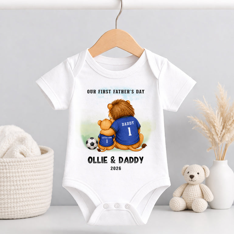 White personalised baby vest with First Father’s Day football lion design and custom Ollie and Daddy wording.