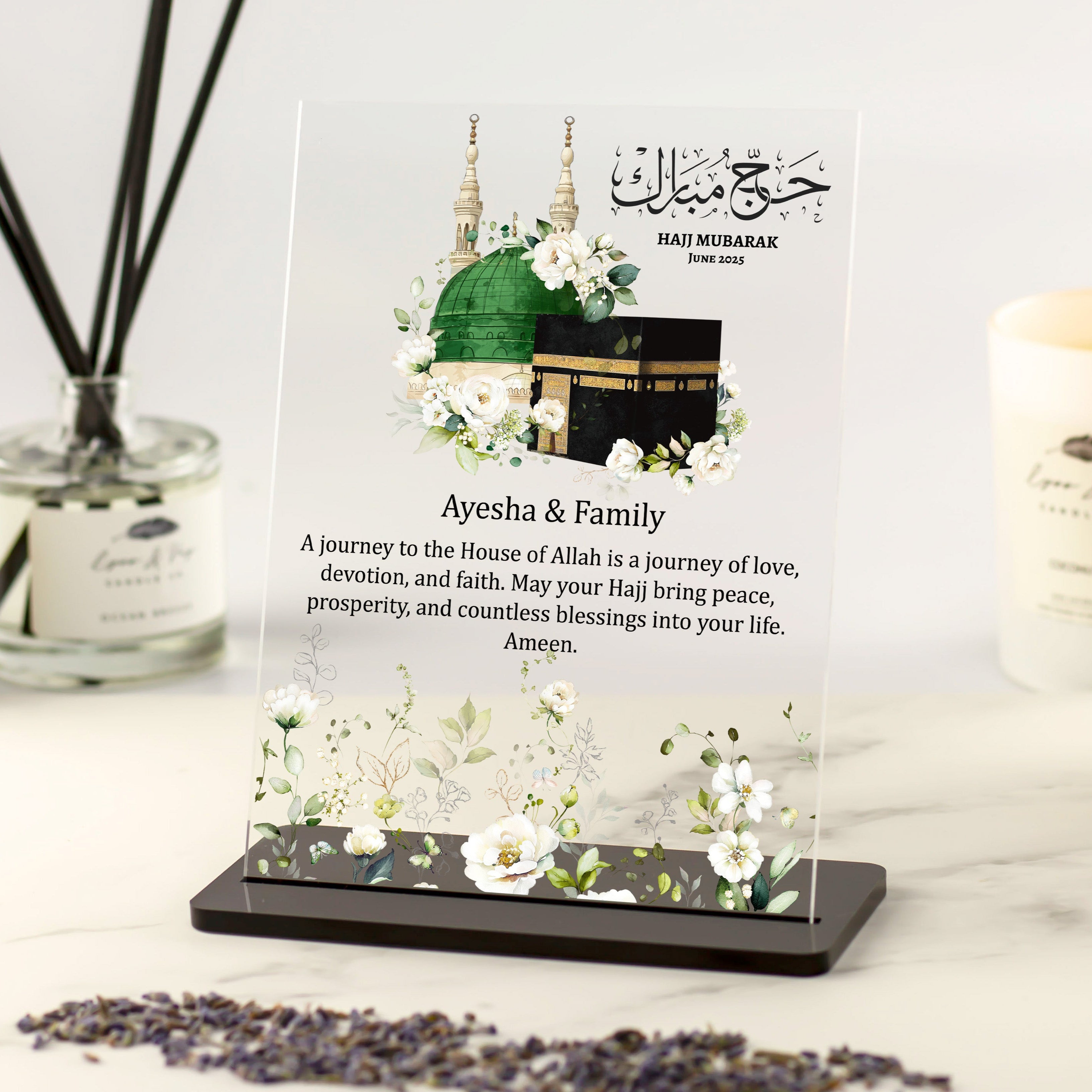 Personalised Hajj Mubarak acrylic plaque featuring Kaaba and Masjid Nabawi floral artwork with custom family name and dua message.