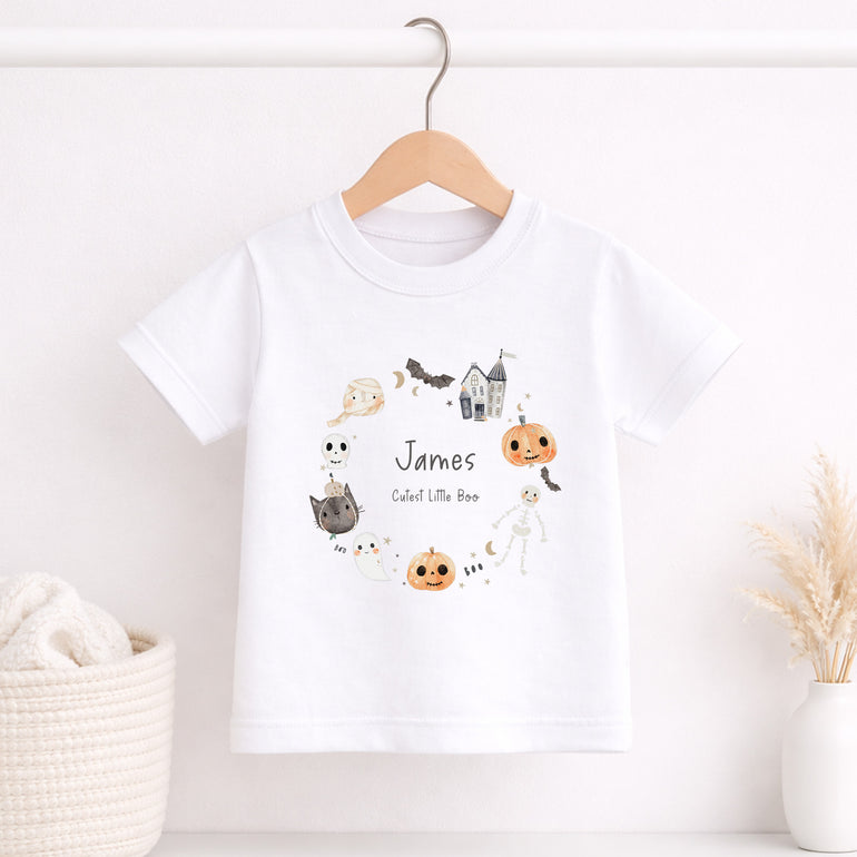 Personalised kids Halloween T-shirt with name James, Cutest Little Boo wording and illustrated pumpkin ghost cat and skeleton motifs