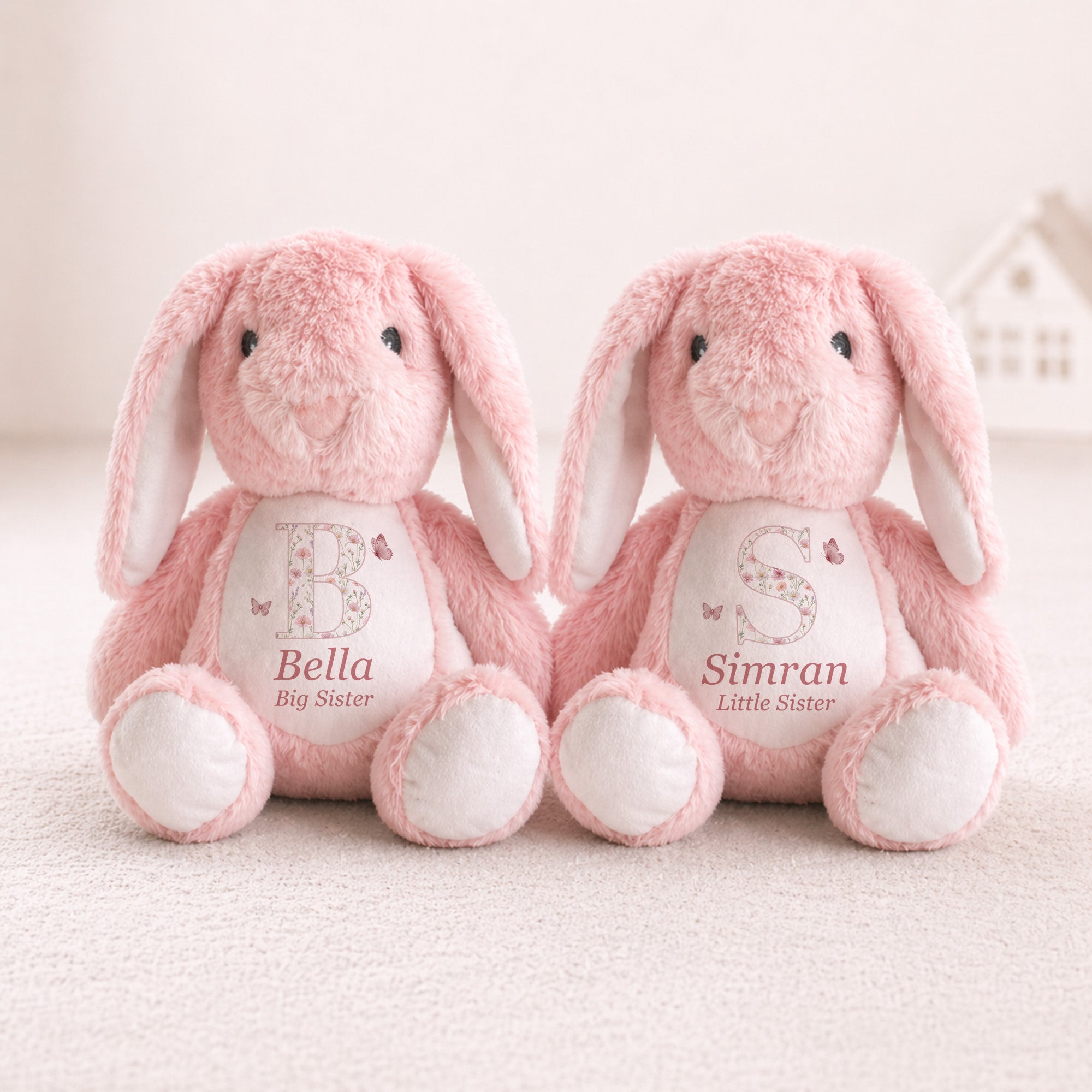 Personalised pink big sister and little sister bunny plush toys with floral initials and names