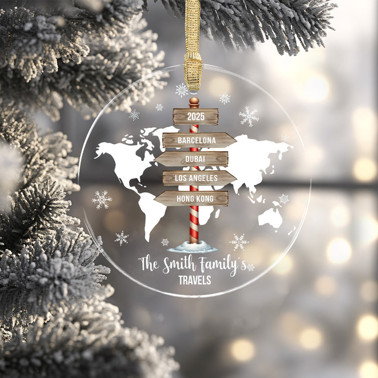 Decorative Christmas ornament with world map and travel destinations on a tree.